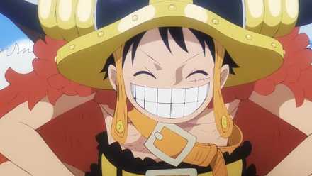 Luffy souriant dans son costume d'Elbaf dans One Piece.