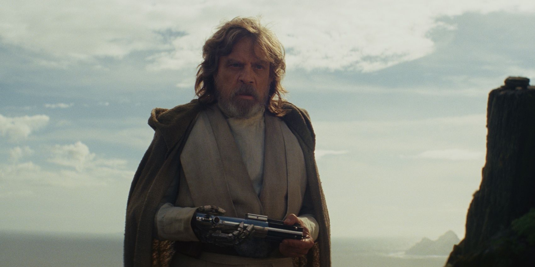 Star-Wars-Last-Jedi-Luke-Skywalker-holding-lightsaber.jpg