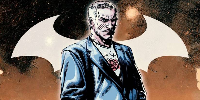 The 45 Greatest Batman Villains Of All Time Carmine Falcone in front of the bat symbol.