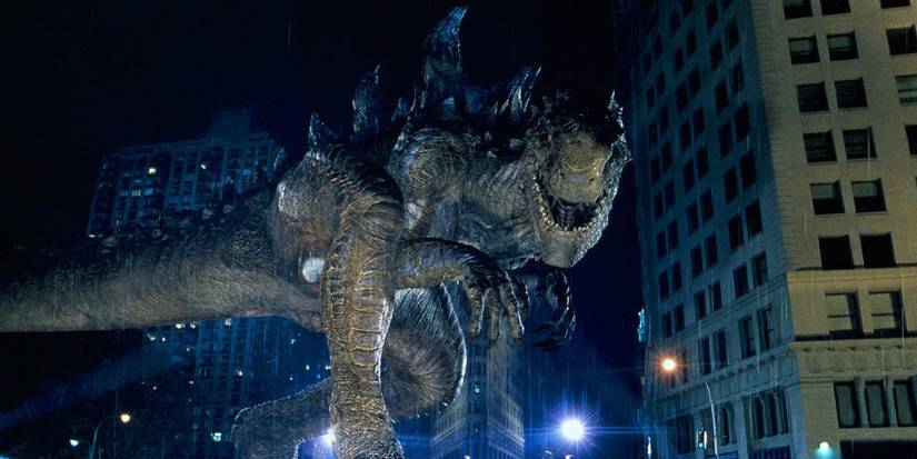 Godzilla walking between buildings in the 1998 movie.