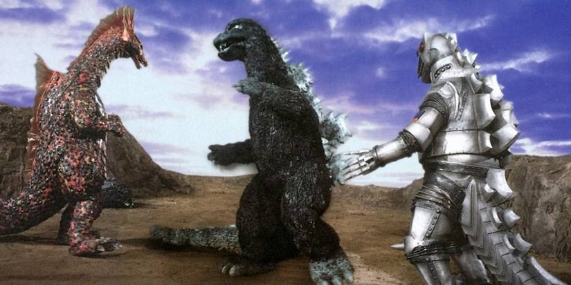 Titanosaurus, Godzilla, and Mechagodzilla fighting on a rocky terrain in Terror of Mechagodzilla