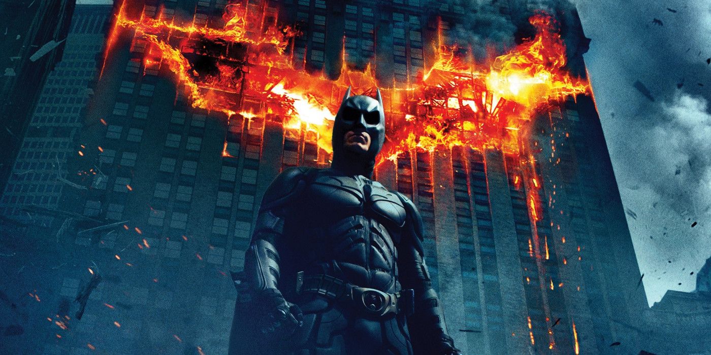 The Dark Knight Standing Before a Burning Gotham