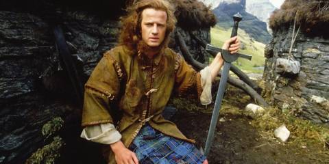 Connor MacLeod holding his sword in Highlander 