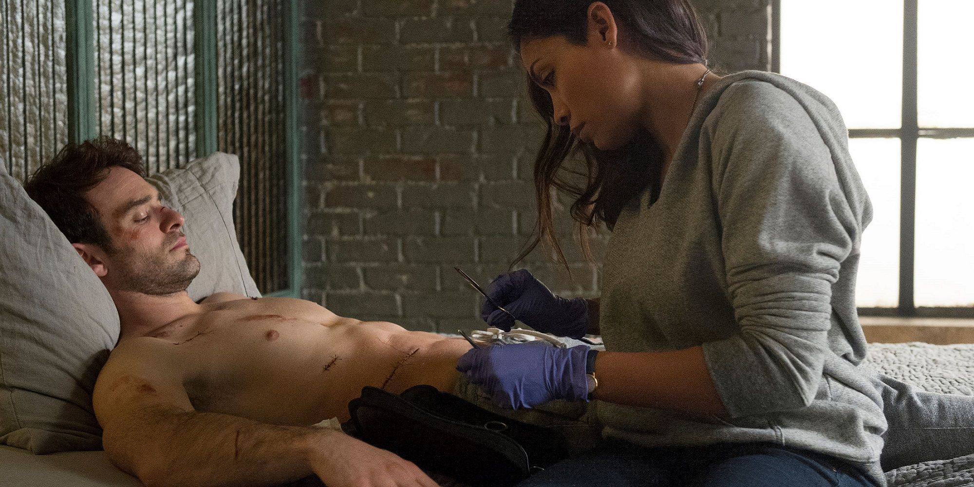 Claire Temple taking care of the injured Matt Murdock