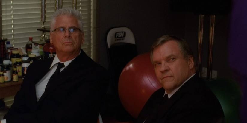 Tim Stanwick (Barry Bostwick) and Barry Jeffries (Meat Loaf) looking at someone on Glee