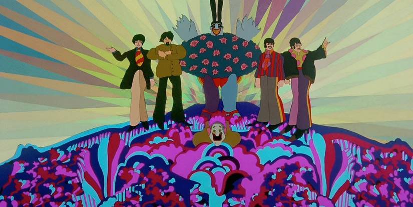 The Beatles standing on a colorful hill with a tree at the top in Yellow Submarine.