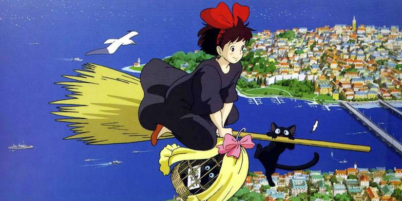 Kiki flying over the city on her broom in Kiki's Delivery Service