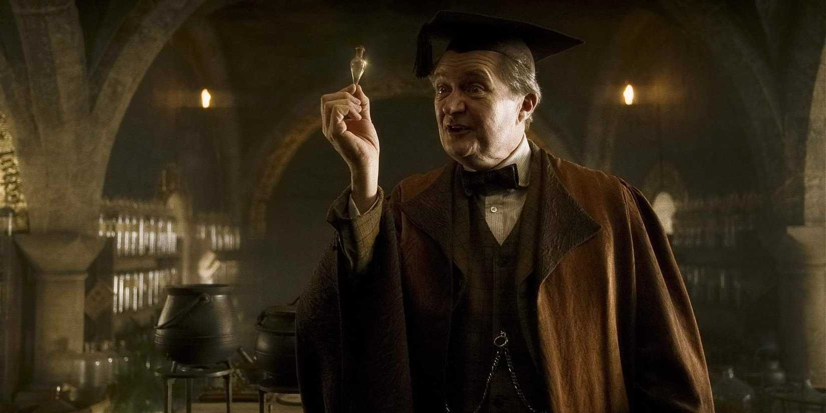 Jim Broadbent as Horace Slughorn in Harry Potter holding up a potion