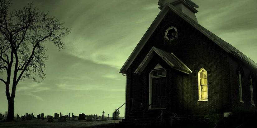 An ominous-looking church with one light on in the window in Revival book cover