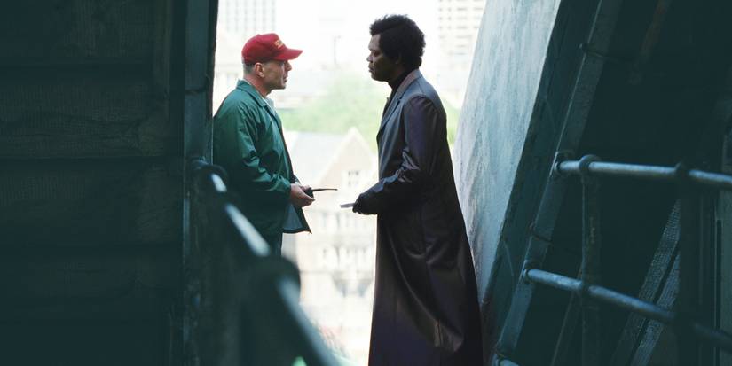 David Dunn (Bruce Willis) talking to Mr. Glass (Samuel L Jackson) at the stadium in Unbreakable