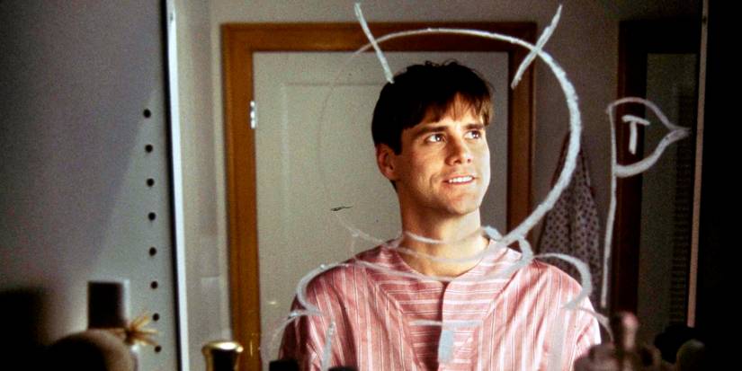 Jim Carrey como Truman Burbank em O Show de Truman, refletido em um espelho.