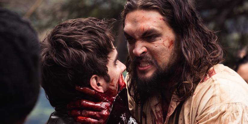 Declan (Jason Momoa) choking Michael Smyth (Landon Liboiron) in Frontier.