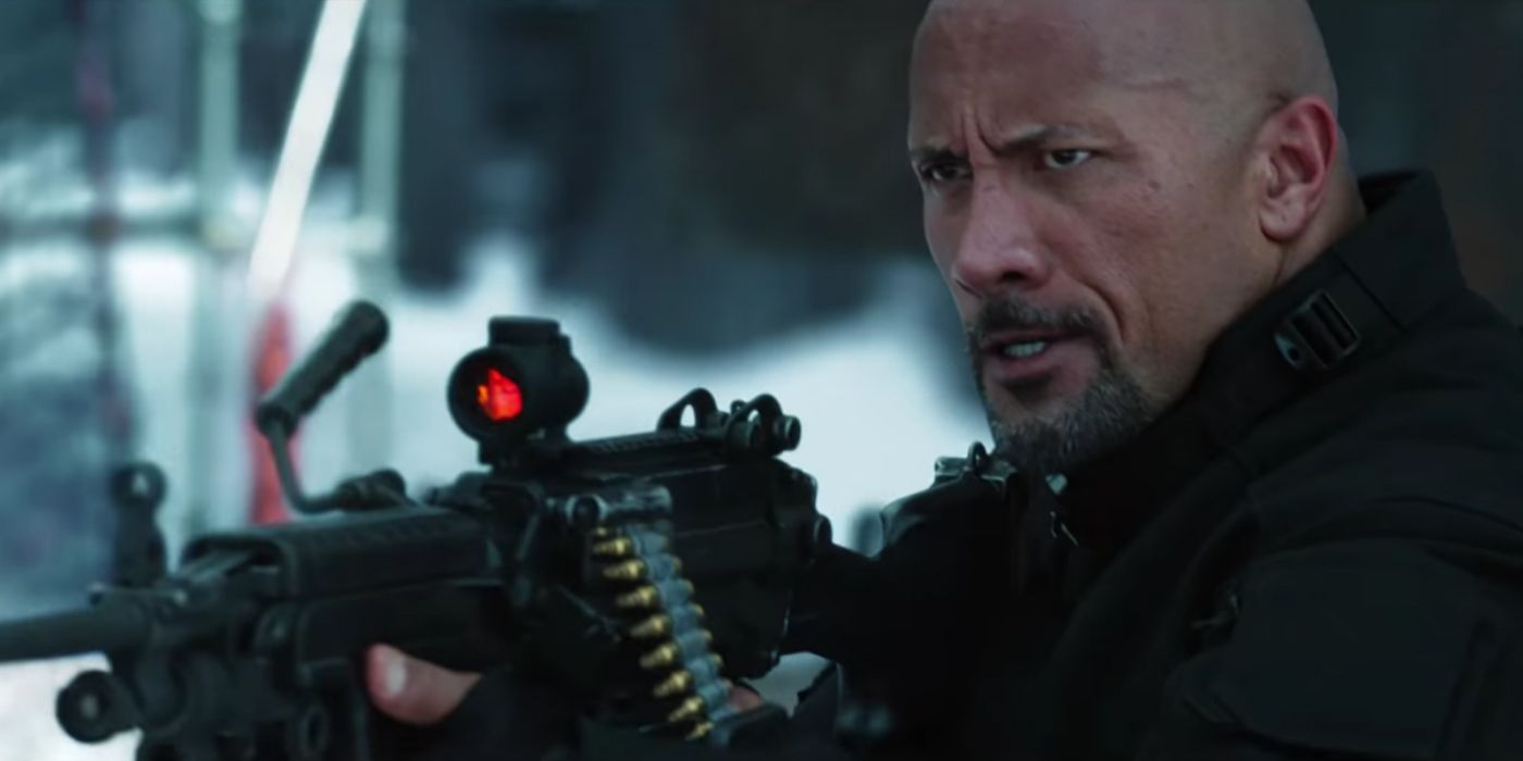 Hobbs (Dwayne 'The Rock' Johnson) with a gun in The Fate of the Furious