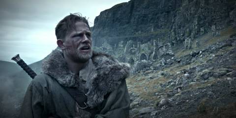 Arthur (Charlie Hunnam) looking exhausted in King Arthur: Legend of the Sword