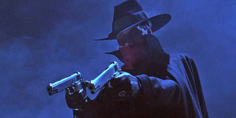 The Shadow pointing a gun in the тιтular movie