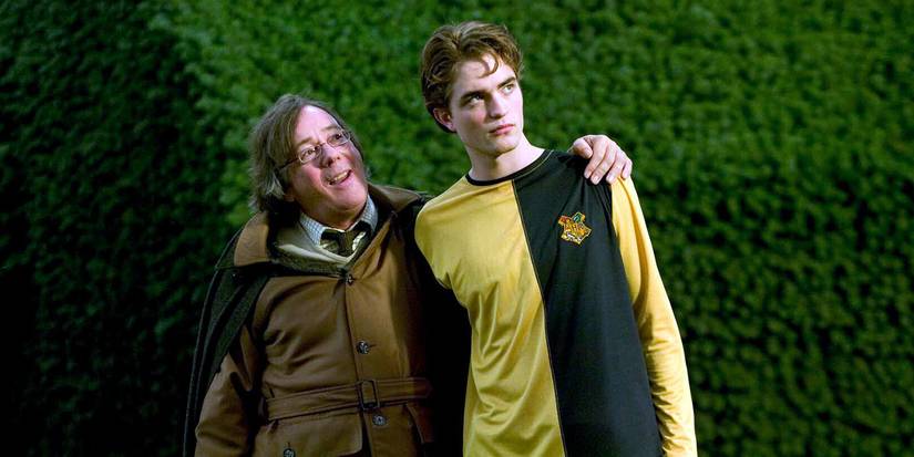 Amos (Jeff Rawle) with his arm around his son Cedric (Robert Pattinson) in Harry Potter and the Goblet of Fire.