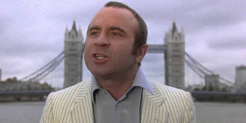 Bob Hoskins talking with Tower Bridge behind him in The Long Good Friday