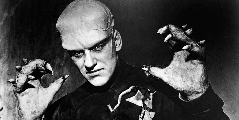 James Arness as The Thing from Another World, The Thing with it's hands up looking menacingly at the camera 