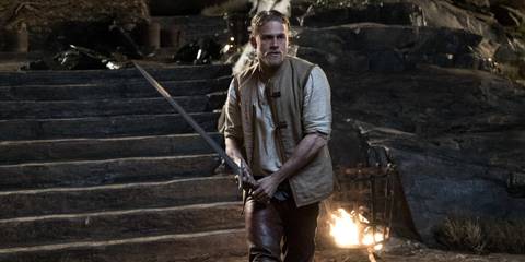 Arthur (Charlie Hunnam) wielding Excalibur in King Arthur: Legend of the Sword