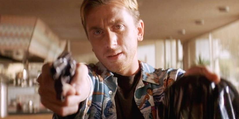 Tim Roth as Pumpkin holding a gun and a bag in Pulp Fiction