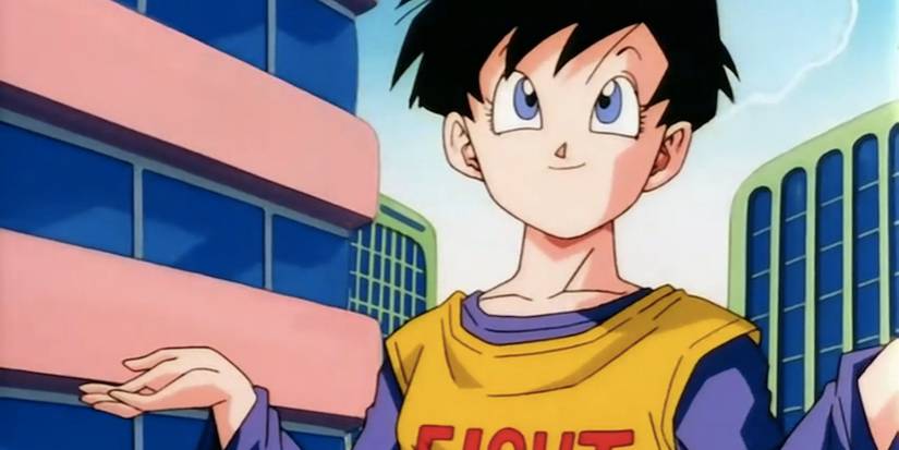 Videl from Dragon Ball Fusion Reborn shrugs her shoulders and smiles in the middle of the city.