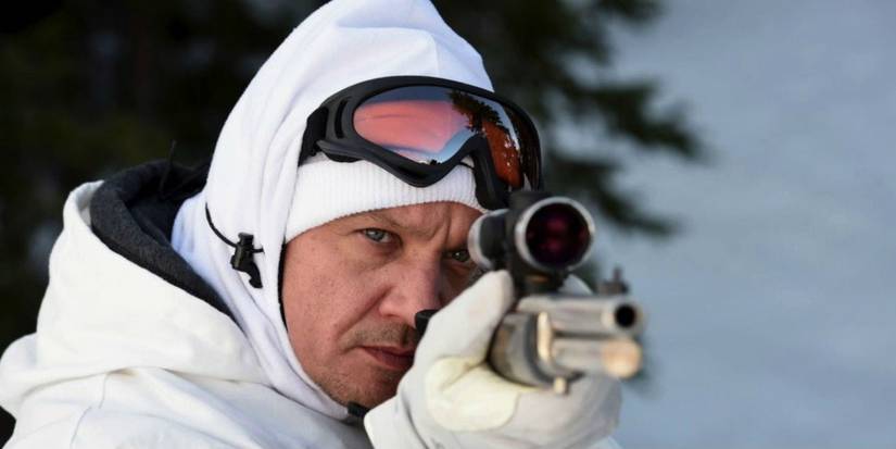 Jeremy Renner aims down a rifle scope in Wind River