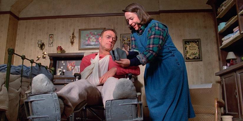 Annie happily showing Paul something in Misery