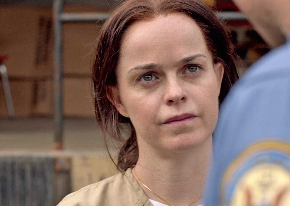 Tiffany Doggett (Taryn Manning) talking to a CO in Orange is the New Black