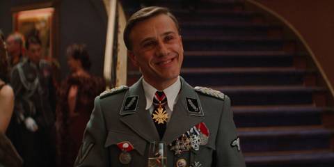 Hans Landa smiling in the movie theater in Inglourious Basterds 