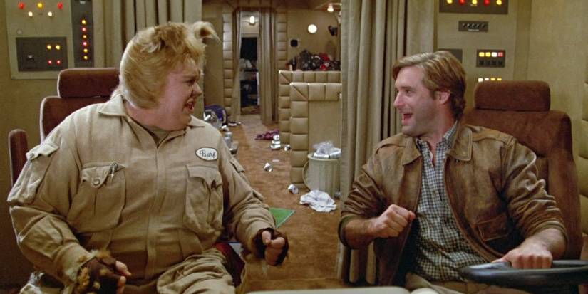Barf (John Candy) and Lone Starr (Bill Pullman) cheer in Spaceballs