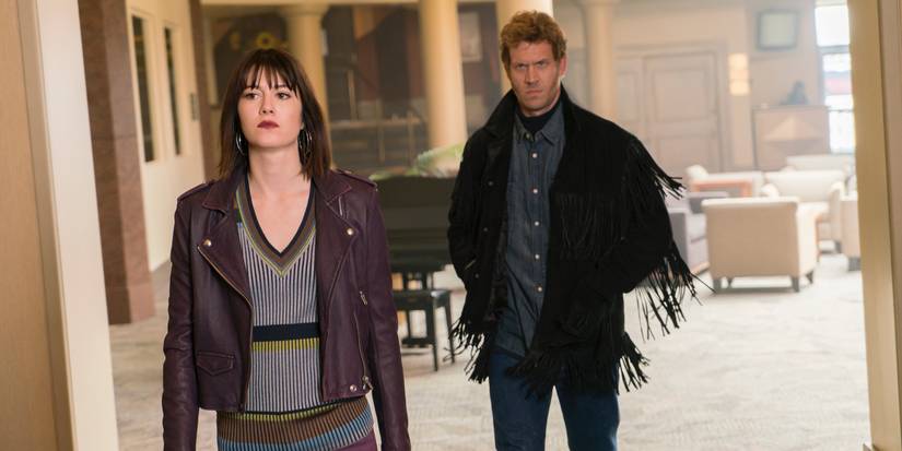 Mary Elizabeth Winstead and Russell Harvard walking through a hotel in Fargo Season 3