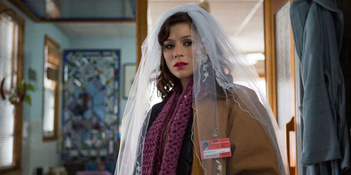 Lorna Morello (Yael Stone) wearing a wedding veil in Orange is the New Black