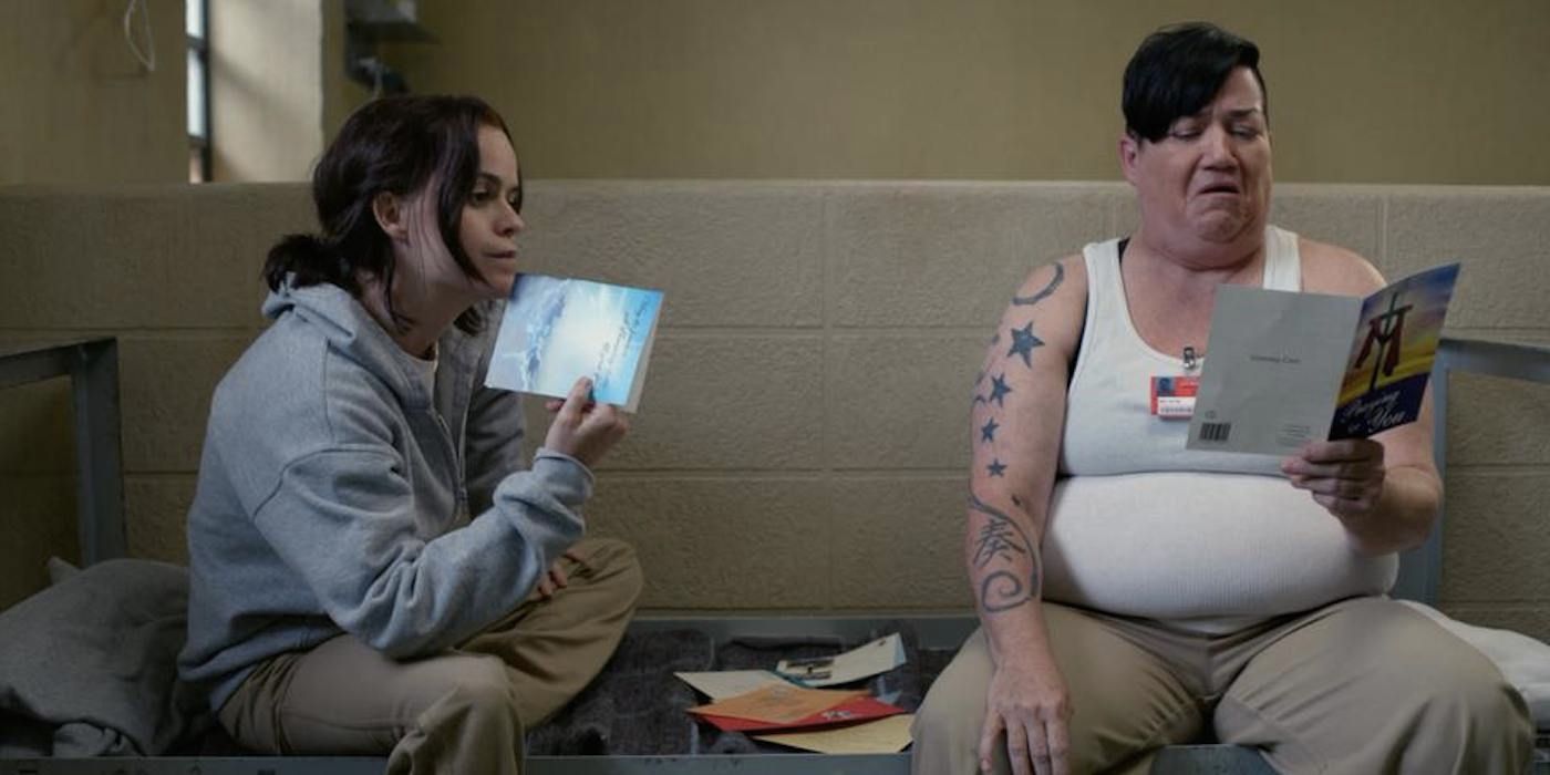 Tiffany Doggett (Taryn Manning) and Big Boo (Lea DeLaria) looking at pamphlets in Orange is the New Black