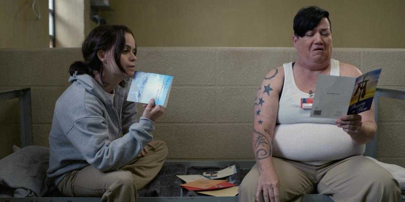 Tiffany Doggett (Taryn Manning) and Big Boo (Lea DeLaria) looking at pamphlets in Orange is the New Black