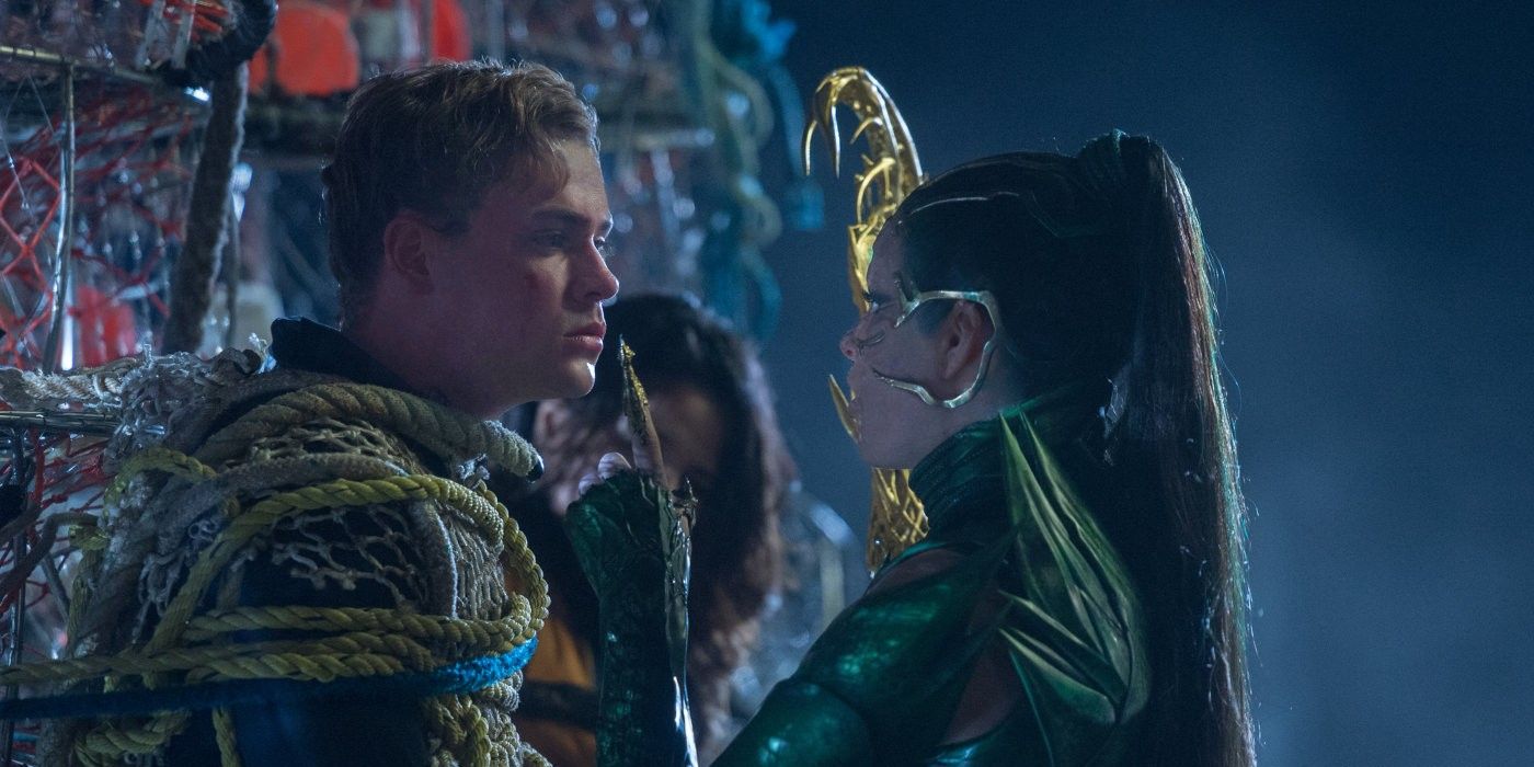 Dacre Montgomery as Jason Red Ranger and Elizabeth Banks as Rita Repulsa in Power Rangers