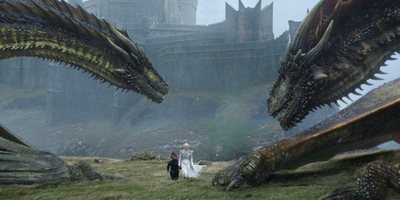 Tyrion and Daenerys at Dragonstone, surrounded by Viserion, Drogon, and Rhaegal in Game of Thrones season 7