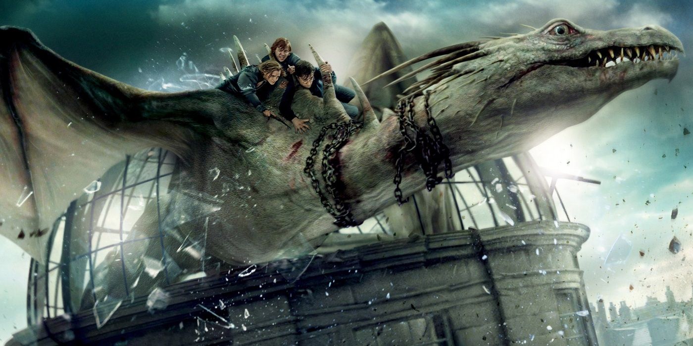 harry ron and hermione on dragon in deathly hallows