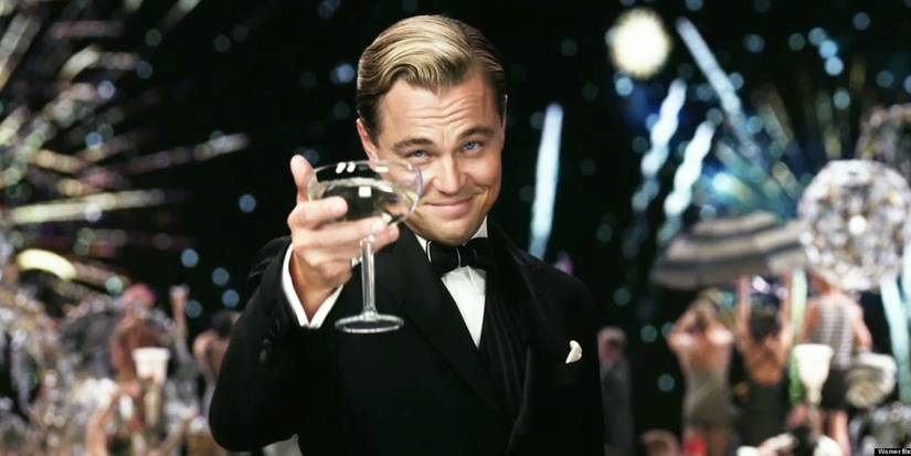 Entourage's 10 Best Fake Movies 8 Jay Gatsby (Leonardo DiCaprio) raising a glass of champagne in The Great Gatsby.