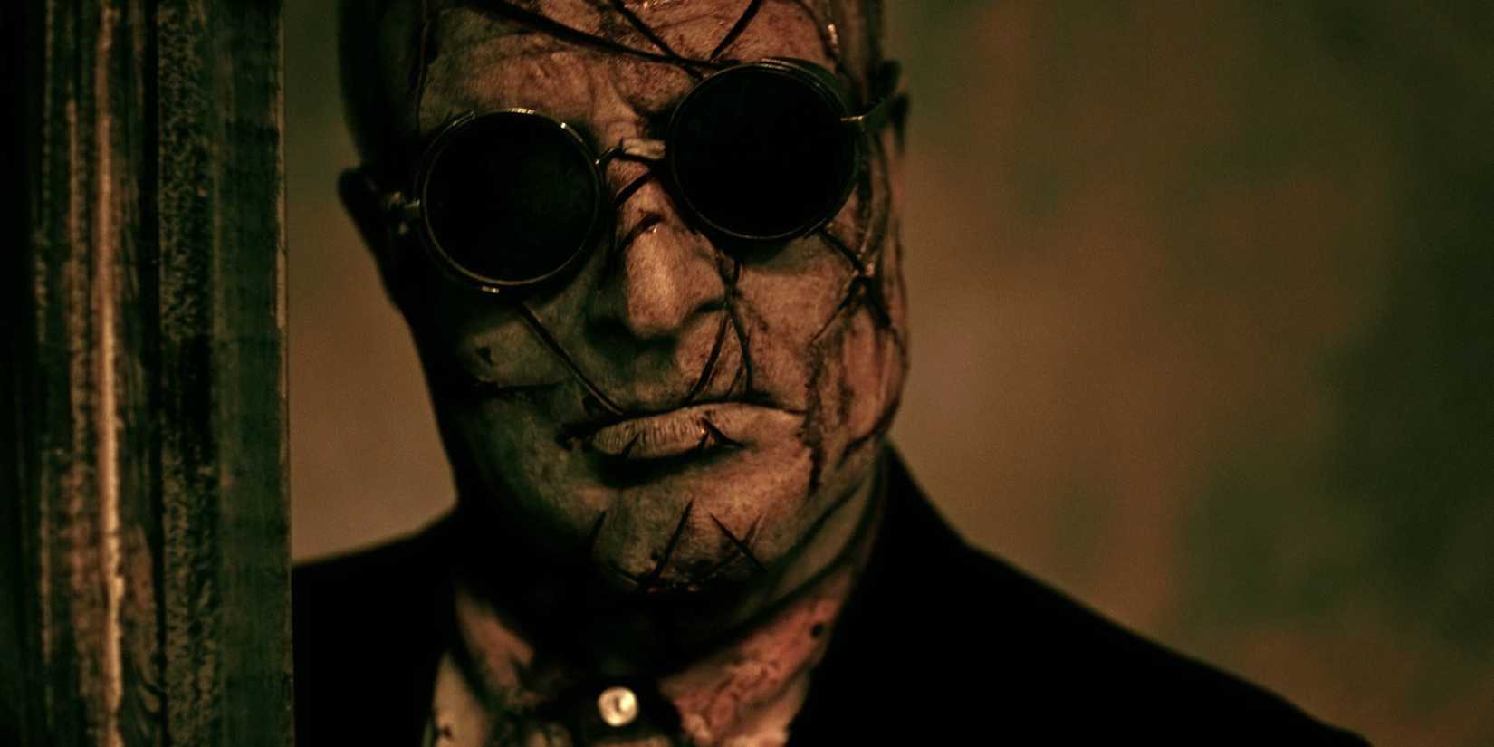 The Auditor with his head to one side and looking at the camera in Hellraiser Judgment