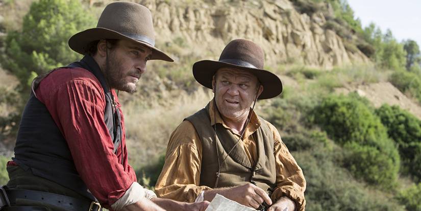 An Underrated Western Gem With Stellar Ensemble Cast 3 John C Reilly and Joaquin Phoenix riding horses in The Sisters Brothers