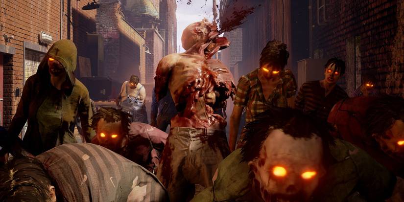 A horde of zombies walks through an alley in State of Decay 2.