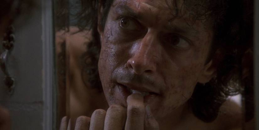 jeff goldblum as seth brundle checking his teeth