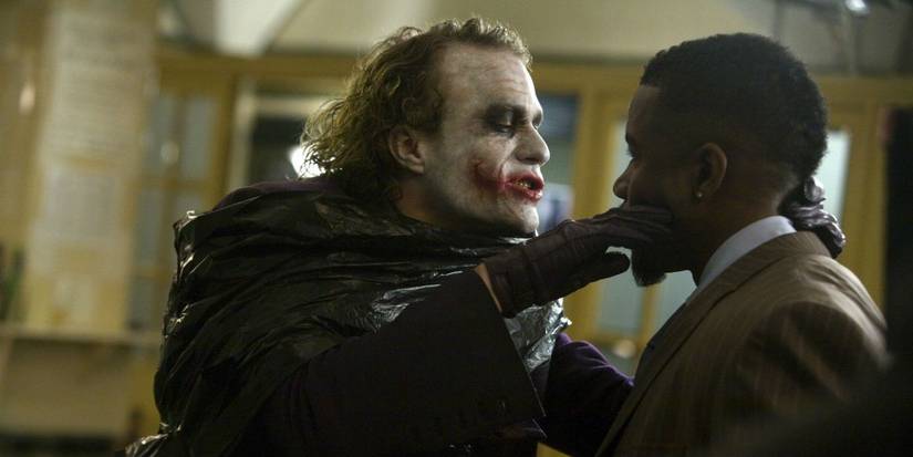 Joker holds a knife to Gambol'sface in The Dark Knight