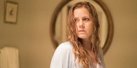 Amy Adams as Camille Preaker looking disturbed in Sharp Objects