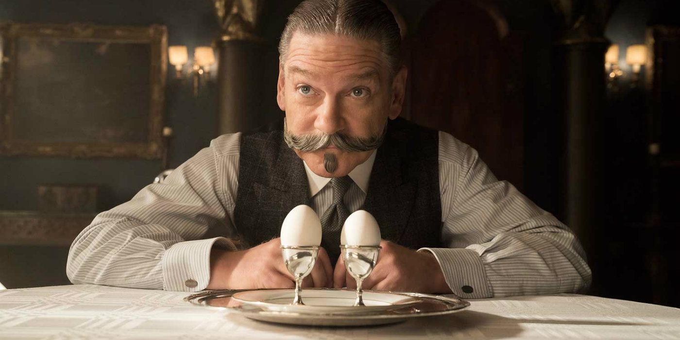 Kenneth Branagh as Hercule Poirot inspects two eggs in Murder on the Orient Express