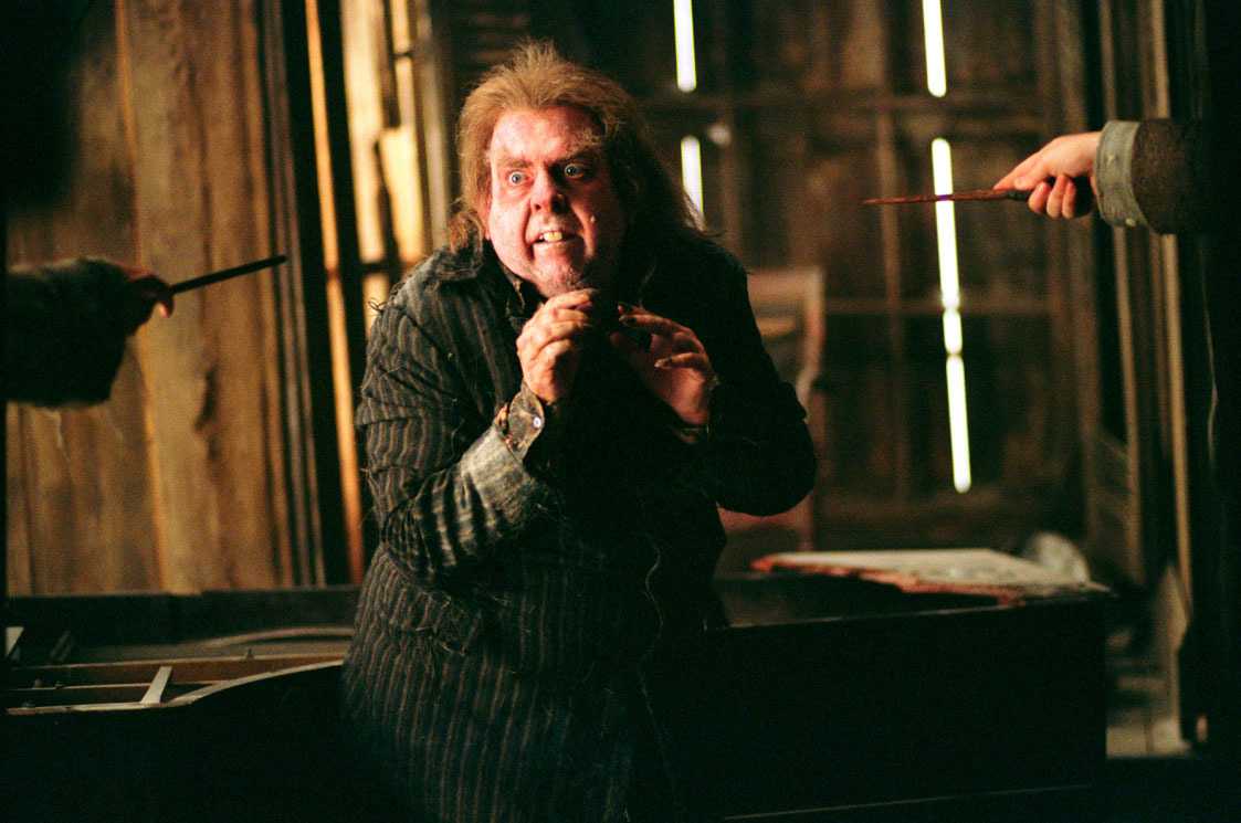 Wormtail being held at wand point by Sirius and Remus