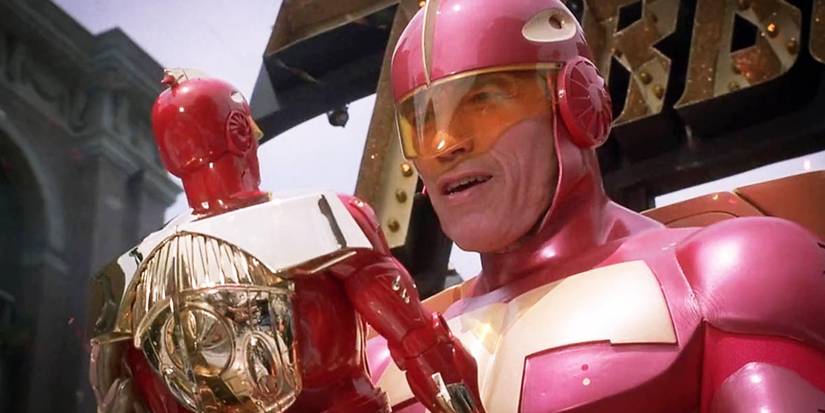 Turbo Man holds Turbo Man in Jingle All The Way