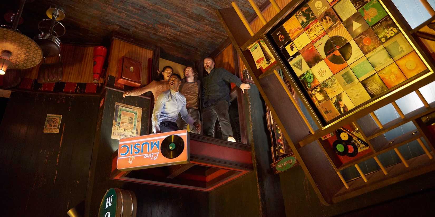 The player stand in an upside down themed room in Escape Room