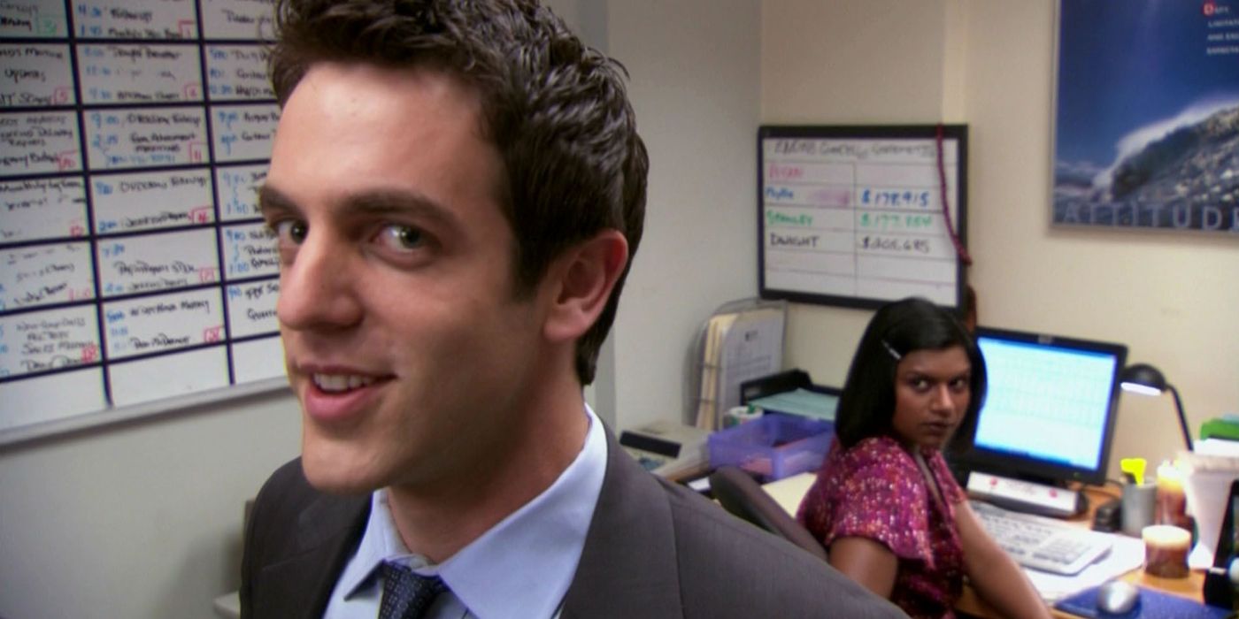 BJ Novak as Ryan looking at the camera while Mindy Kaling as Kelly looks at him in The Office.