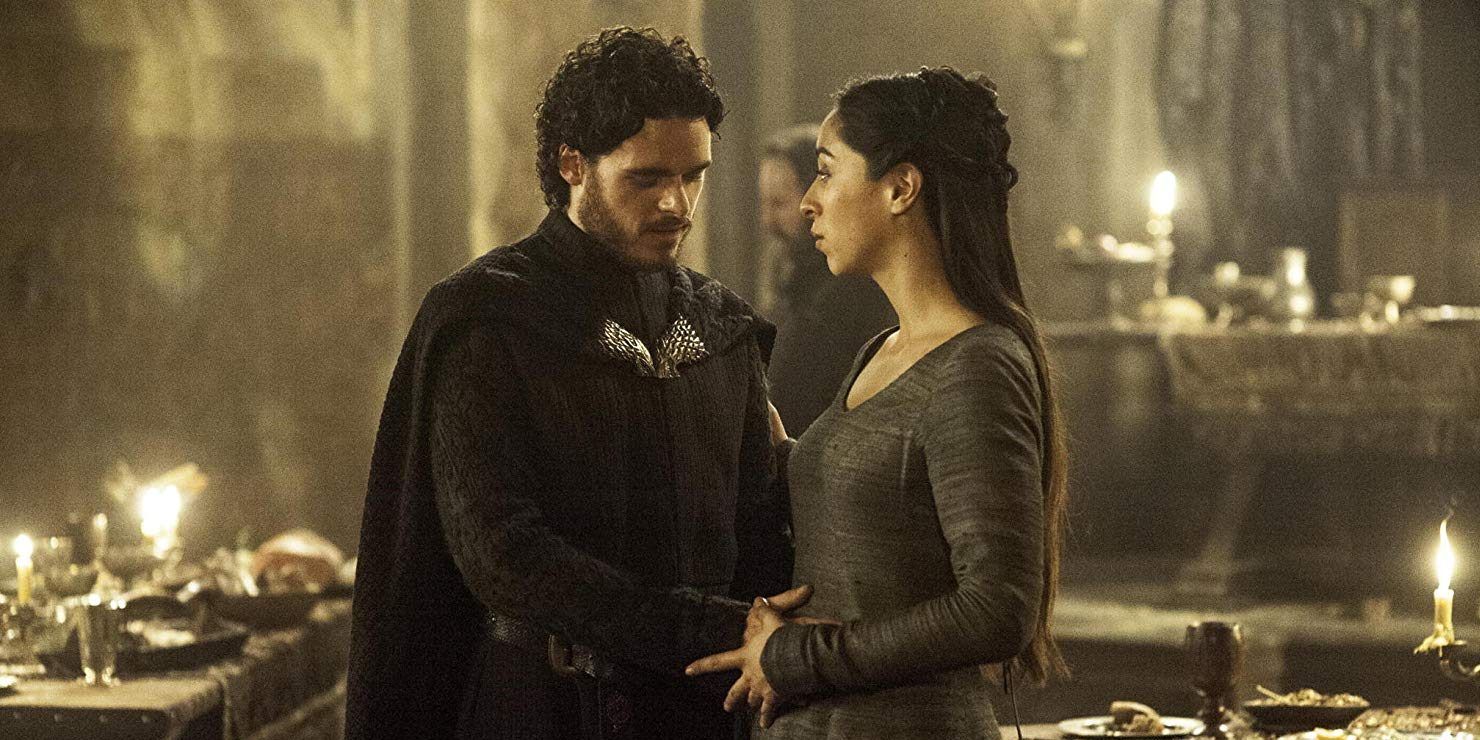 Robb Stark (Richard Madden) holding his wife Talisa's (Oona Chaplin) stomach right before the Red Wedding.